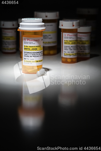 Image of Hydrocodone Pills and Prescription Bottles with Non Proprietary 