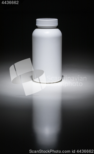 Image of Blank White Bottle Ready For Your Text Under Spot Light.