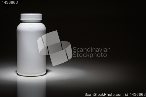 Image of Blank White Bottle Ready For Your Text Under Spot Light.