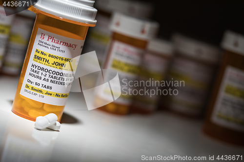 Image of Hydrocodone Pills and Prescription Bottles with Non Proprietary 
