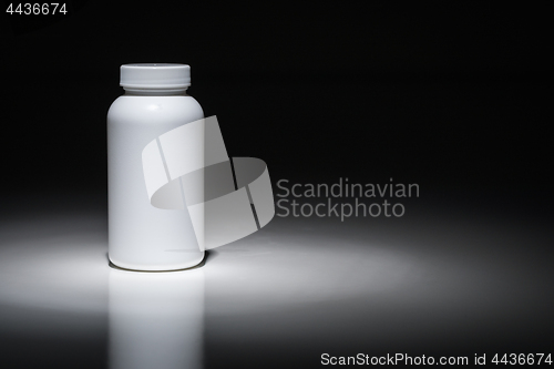 Image of Blank White Bottle Ready For Your Text Under Spot Light.