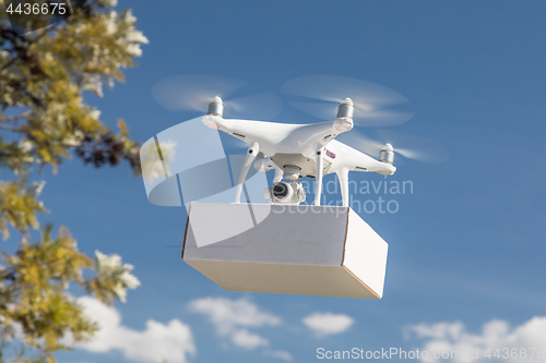 Image of Unmanned Aircraft System (UAS) Quadcopter Drone Carrying Blank P