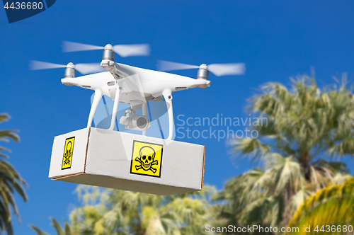 Image of Unmanned Aircraft System (UAV) Quadcopter Drone Carrying Package