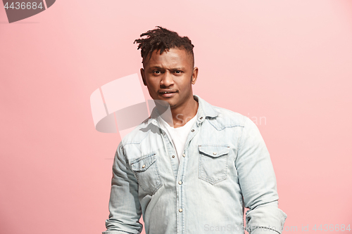 Image of Handsome man looking suprised isolated on pink