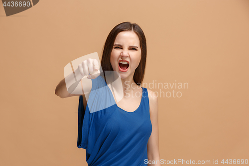 Image of The overbearing woman point you and want you, half length closeup portrait on pastel background.