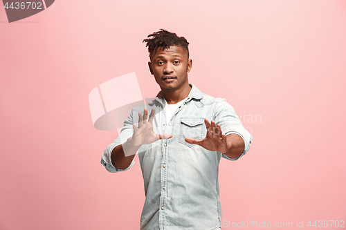 Image of Handsome man looking suprised isolated on pink