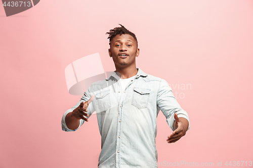 Image of Handsome man looking suprised isolated on pink