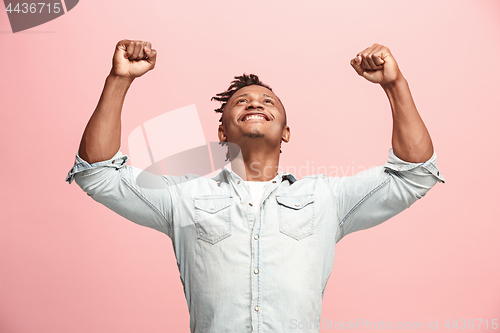 Image of Winning success man happy ecstatic celebrating being a winner. Dynamic energetic image of male model