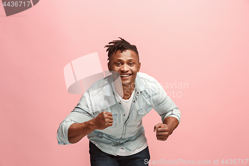 Image of Winning success man happy ecstatic celebrating being a winner. Dynamic energetic image of male model