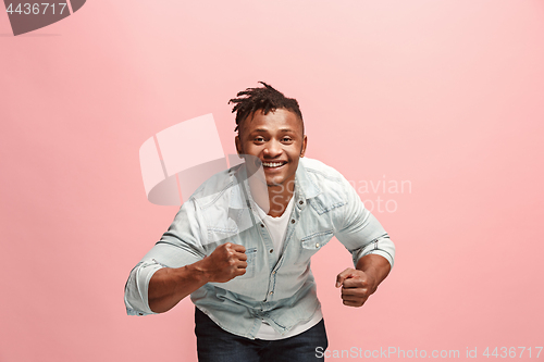Image of Winning success man happy ecstatic celebrating being a winner. Dynamic energetic image of male model