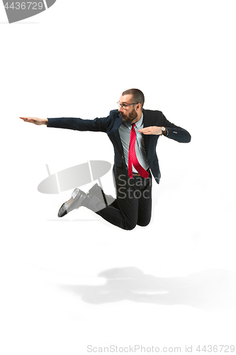 Image of Funny cheerful businessman jumping in air over white background