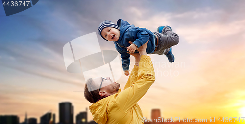 Image of father with son playing and having fun outdoors