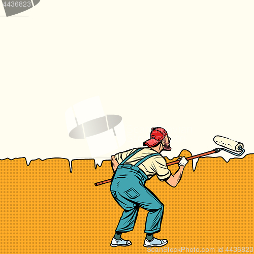 Image of worker painter paints wall in the middle