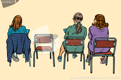 Image of women sit back on chairs