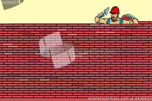 Image of The Builder lays brick masonry at the top