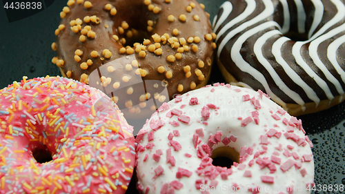 Image of Glazed sweet doughnuts in closeup