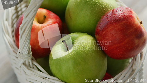 Image of Red and green apples in basket 