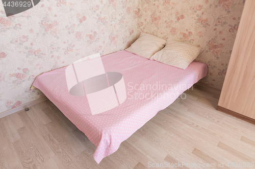 Image of Double bed in the room