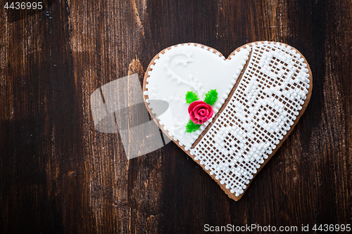 Image of Gingerbread heart on wooden background