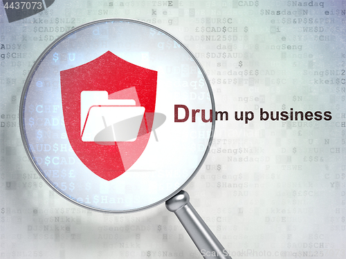 Image of Finance concept: Folder With Shield and Drum up business with optical glass