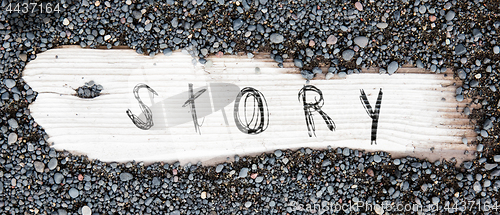 Image of Sand on planked wood - Story