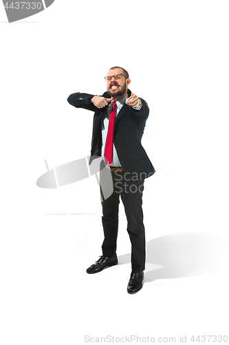 Image of Angry businessman threatening and pointing to camera. Isolated on white.