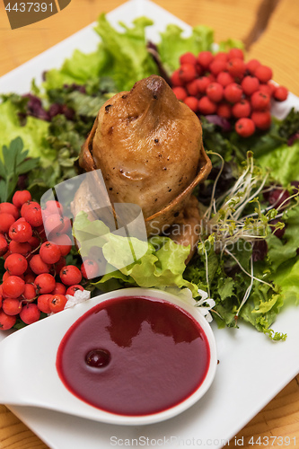 Image of quail roasted with sweet and sour cranberry sauce