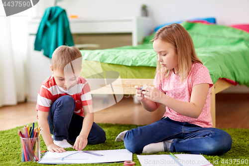 Image of happy creative kids making crafts at home