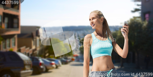 Image of woman with cellphone doing sports in san francisco