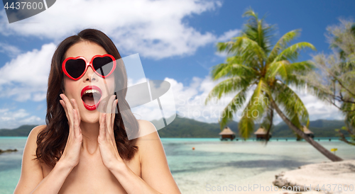 Image of woman with sunglasses over tropical beach