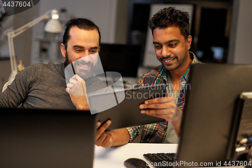 Image of creative team with tablet pc working at office