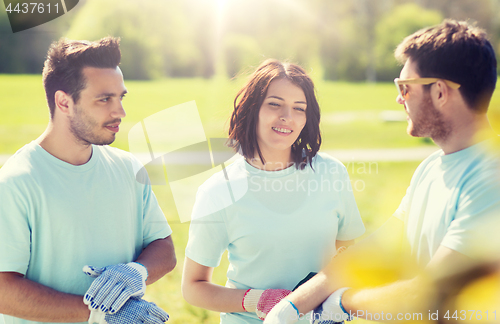 Image of group of volunteers planting tree in park