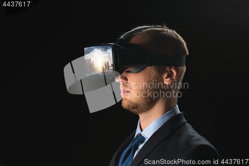 Image of businessman in virtual reality glasses or headset