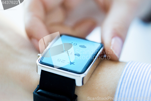 Image of close up of smart watch with social media icons