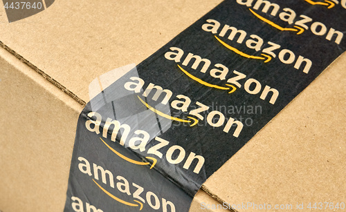 Image of Amazon shipping box with branded tape.