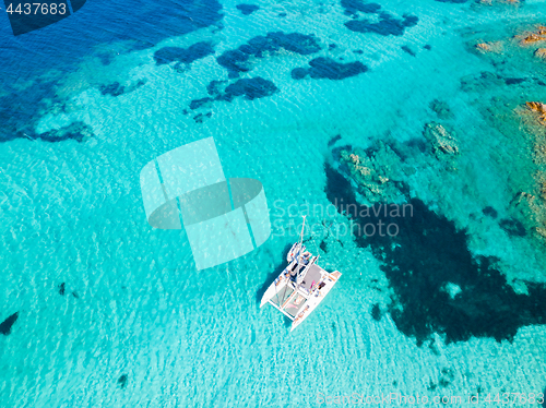 Image of Drone aerial view of catamaran sailing boat in Maddalena Archipelago, Sardinia, Italy.