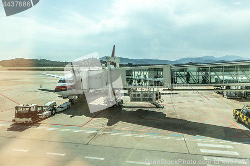 Image of Airplane Boarding on the airport before departure.