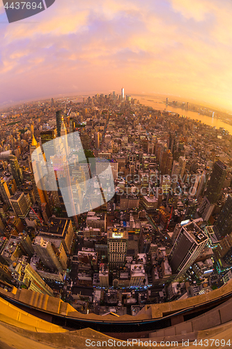 Image of New York City skyline with Manhattan skyscrapers at dramatic stormy sunset, USA.