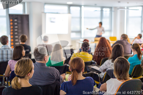 Image of Speaker giving presentation on business conference.