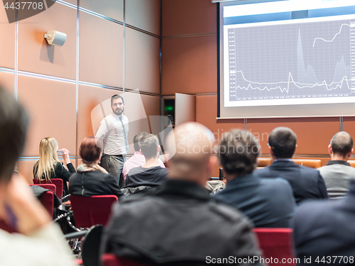 Image of Skiled Public Speaker Giving a Talk at Business Meeting.