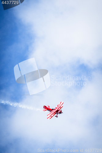 Image of Veteran propeller airplane flying on a blue sky