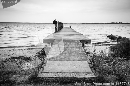 Image of Wooden pier by the sea on a nordic beach