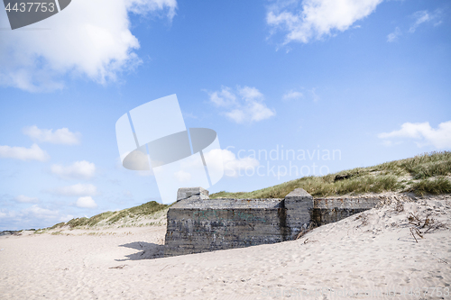 Image of Dune on a beach with ruins of 2nd world war