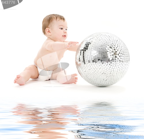 Image of adorable baby boy with big disco ball