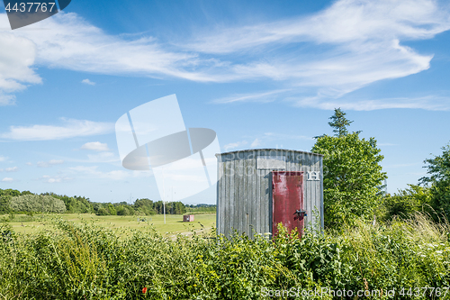 Image of Wooden shed on a rural field