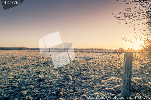 Image of Sunrise on a rural countryside in the winter
