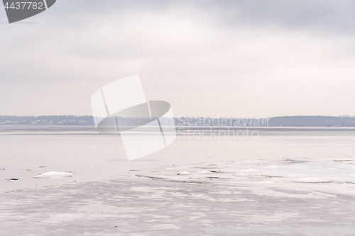 Image of Frozen lake in the wintertime with ice