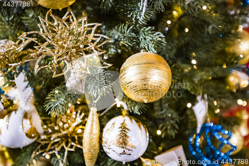 Image of Christmas tree with shiny baubles on a decked tree