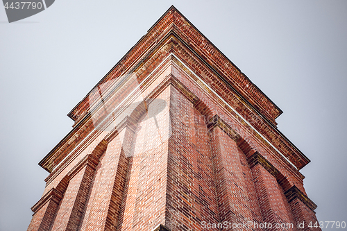 Image of High tower with red bricks from below