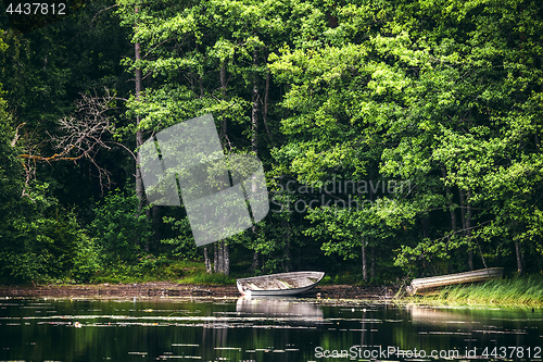 Image of Wooden boat on the shore of a lake